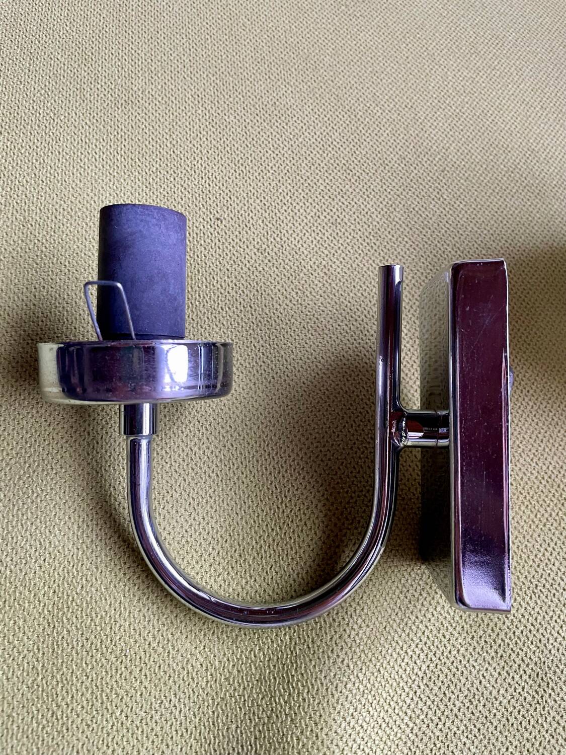 Pair of chrome metal wall lights with white glass globe.