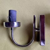 Pair of chrome metal wall lights with white glass globe.