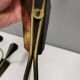 A set of wall lamps in black lacquered metal with brass details