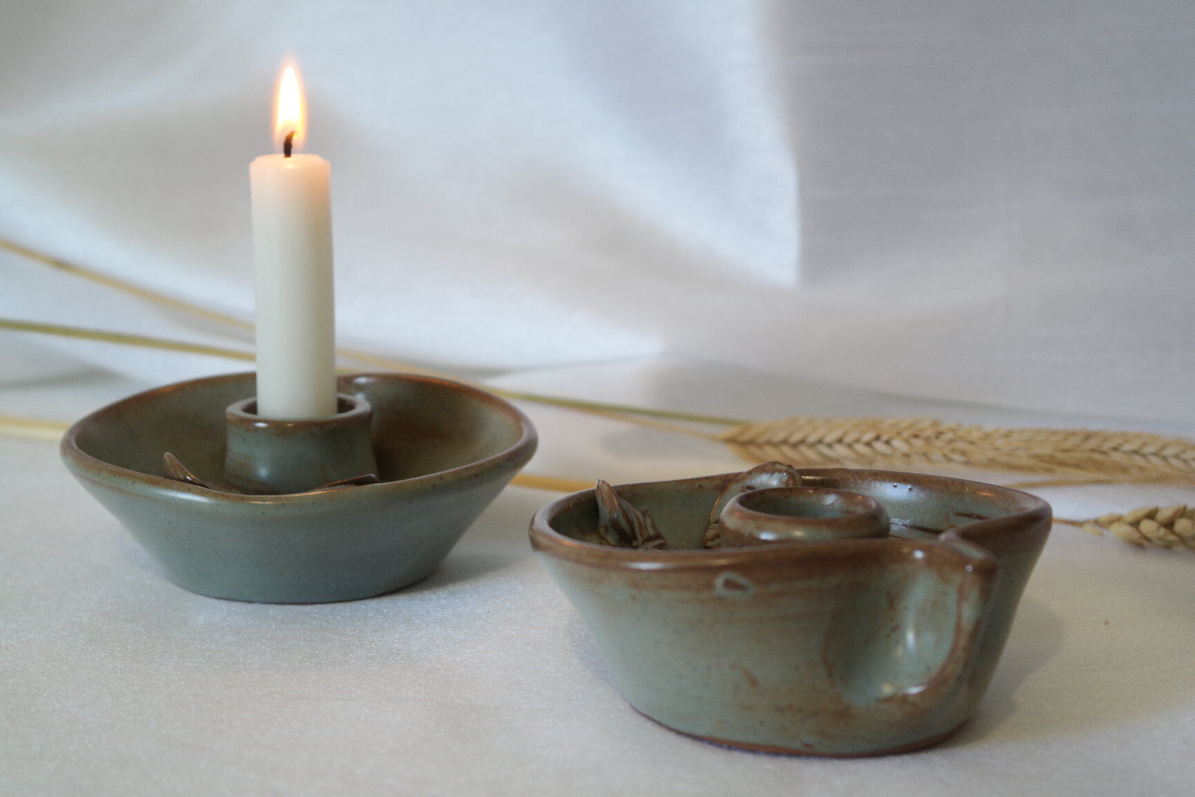 Pair of cellar rat candle holders in glazed sandstone