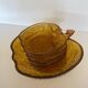 Amber glass dessert service in the shape of an apple made in Italy.