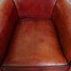 Armchair made of sheepskin leather in a red/brown color