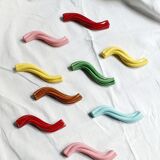 Set of 9 enamelled ceramic knife holders