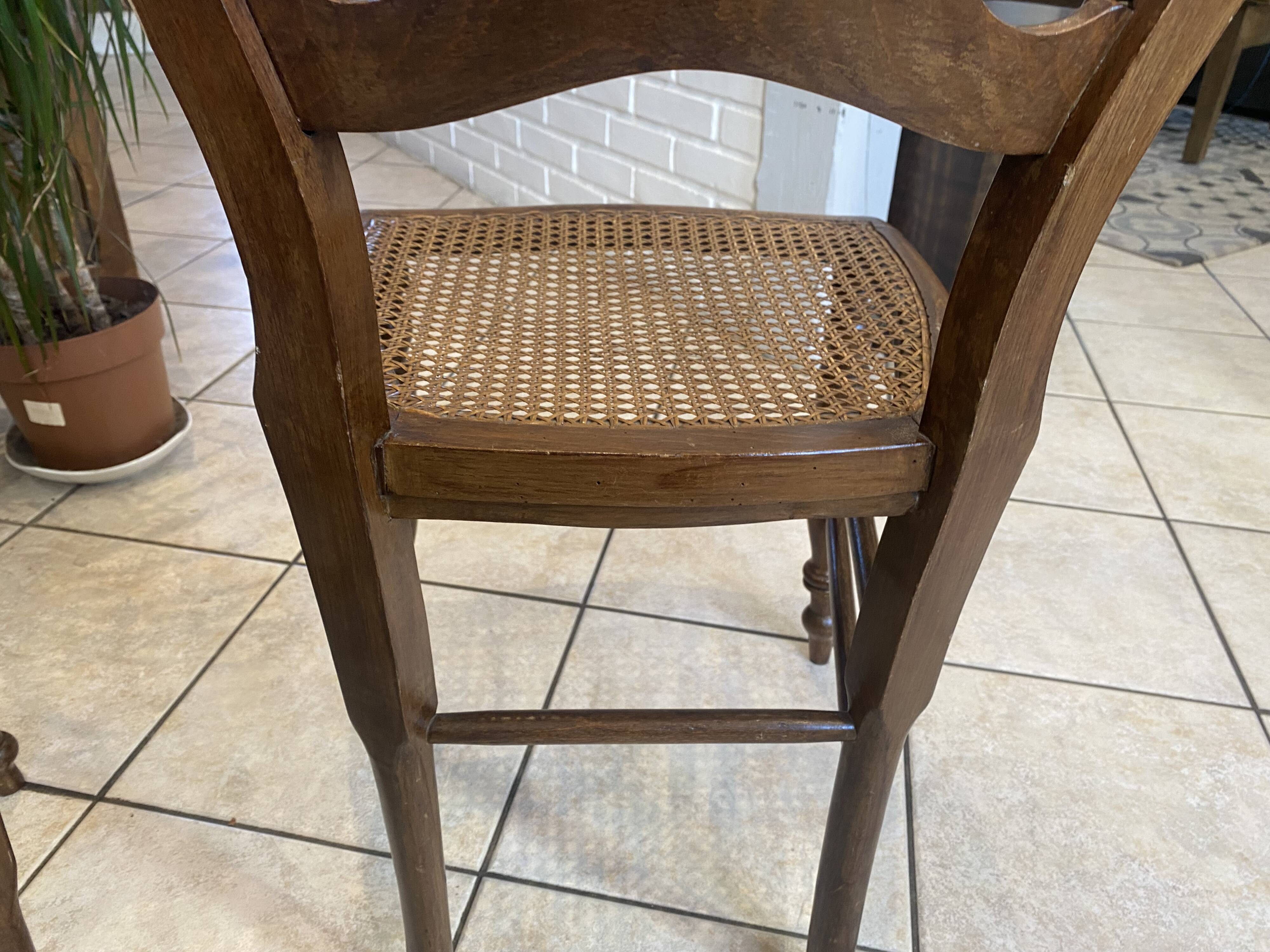 Pair of N2 antique caned and wooden chairs from the 1900s.