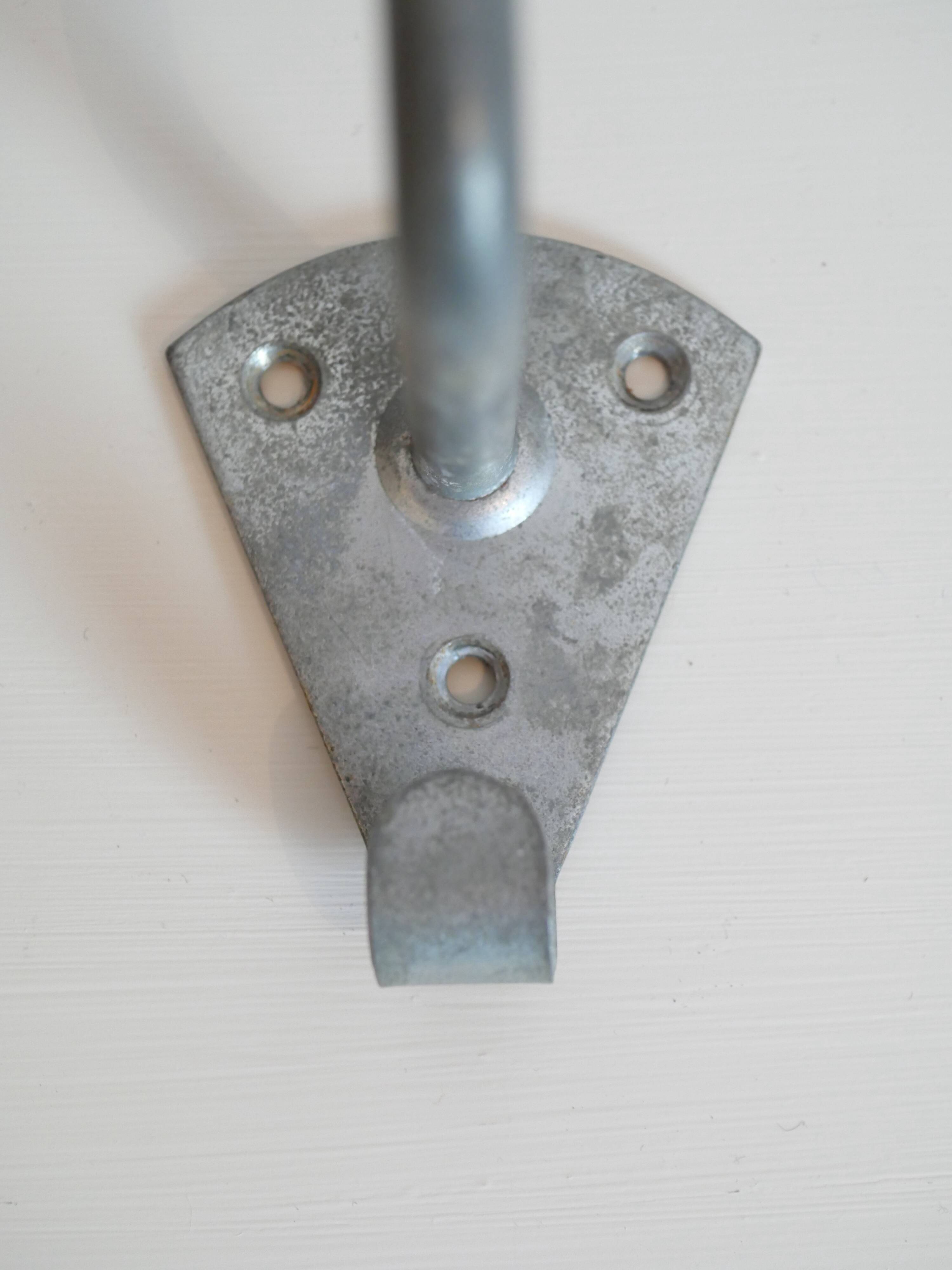 Pair of school coat hooks in Bakelite and metal from the 1950s.