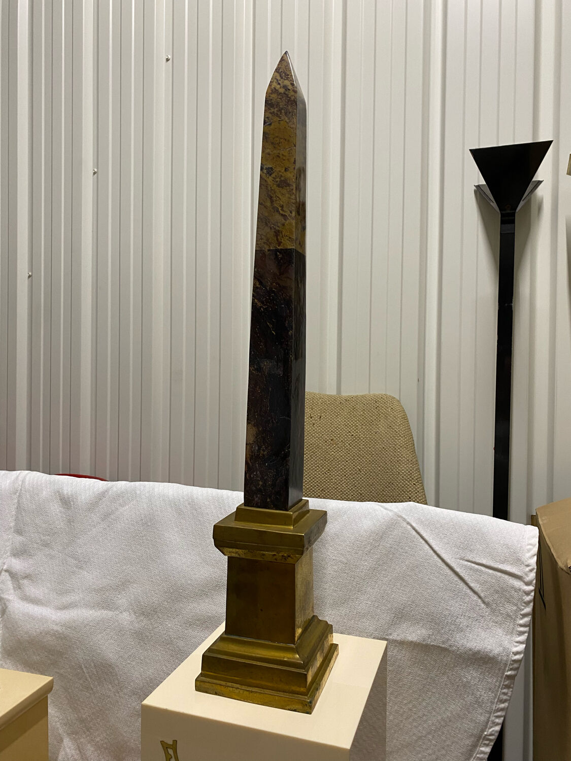 Obelisk stone brass base