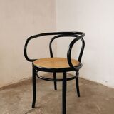 Curved wood and cane armchair called "Le Corbusier"