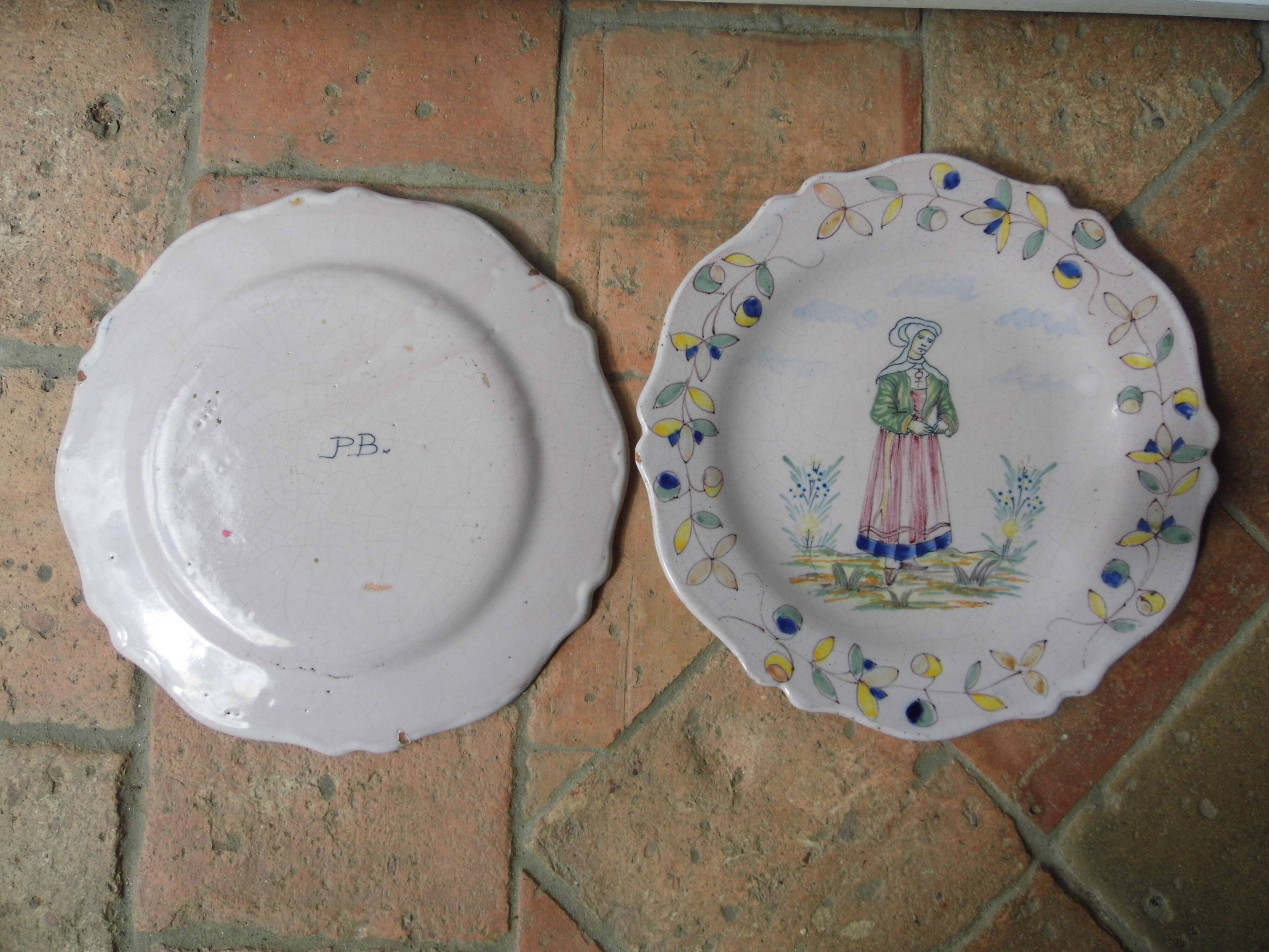 Malicorne earthenware plates, late nineteenth century, Breton décor.