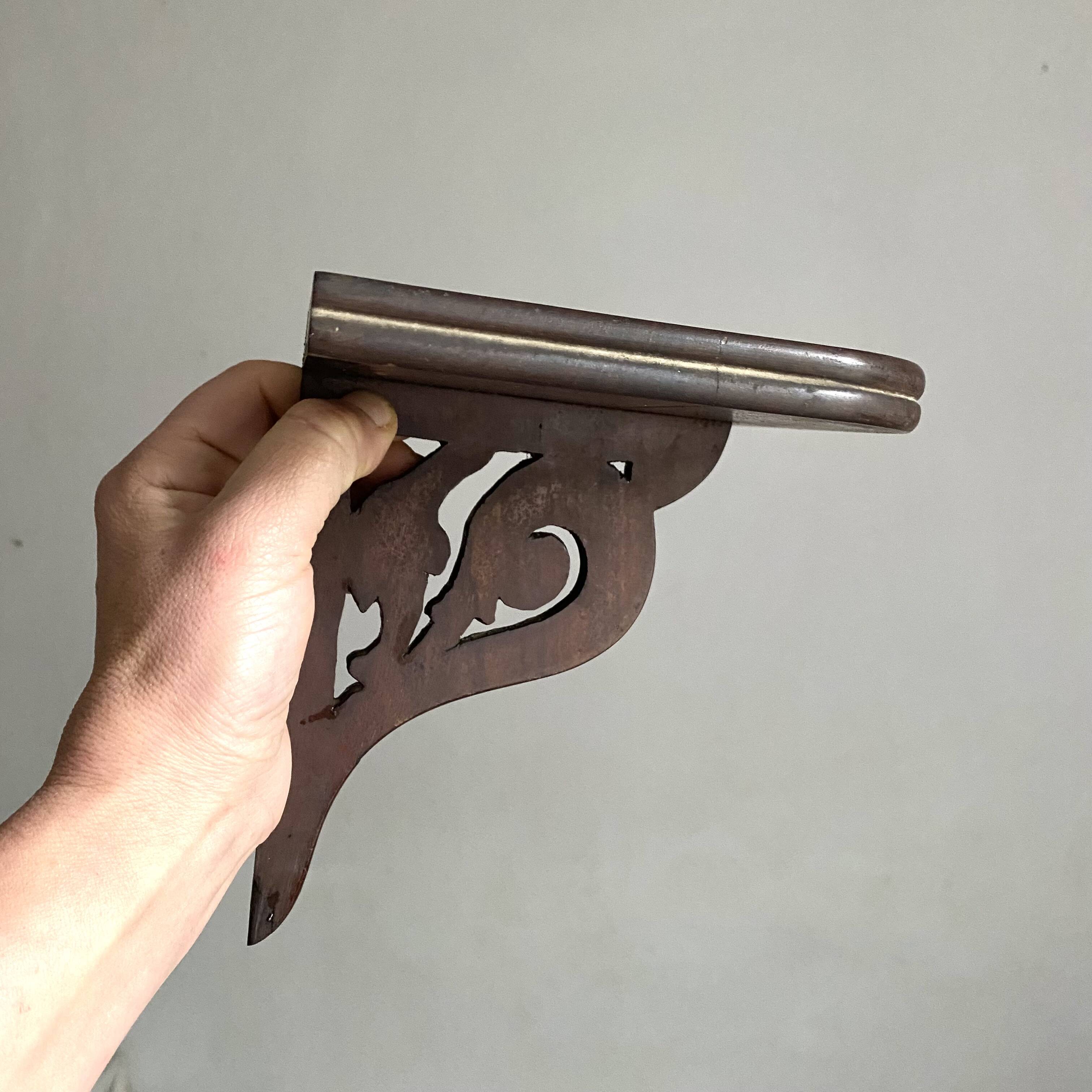 small old openwork wooden wall shelf