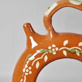 Circular glazed terracotta gargoulette