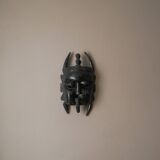 Decorative mask hand carved in tribal ethnic painted wood