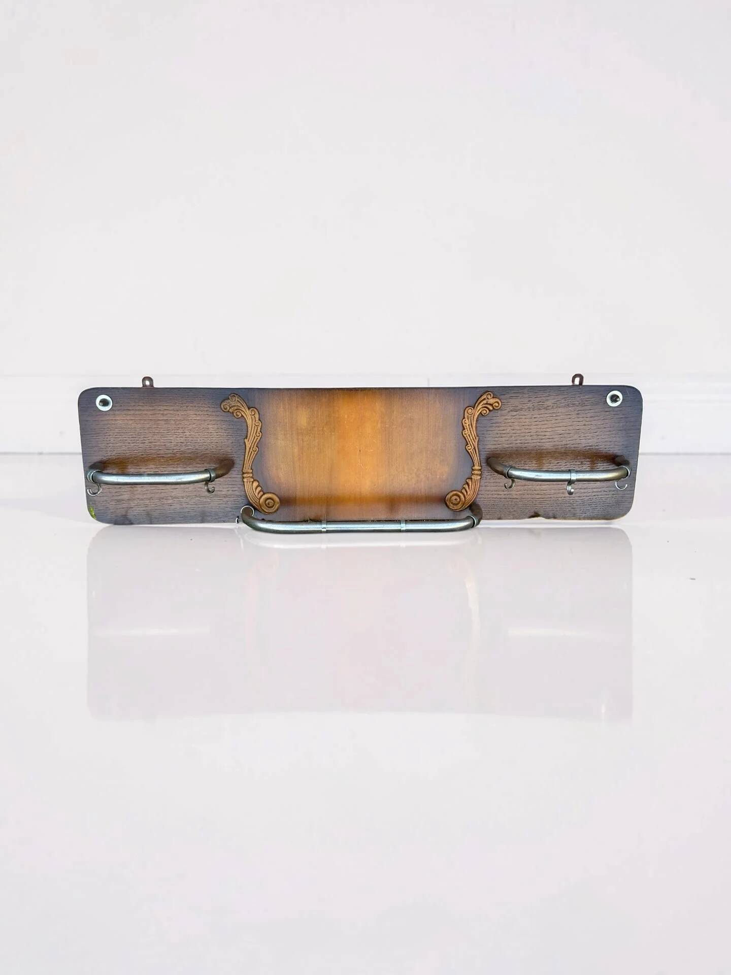 Vintage wooden coat rack with chrome hooks