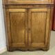 19th-century English corner cabinet in oak, mahogany, and fir.