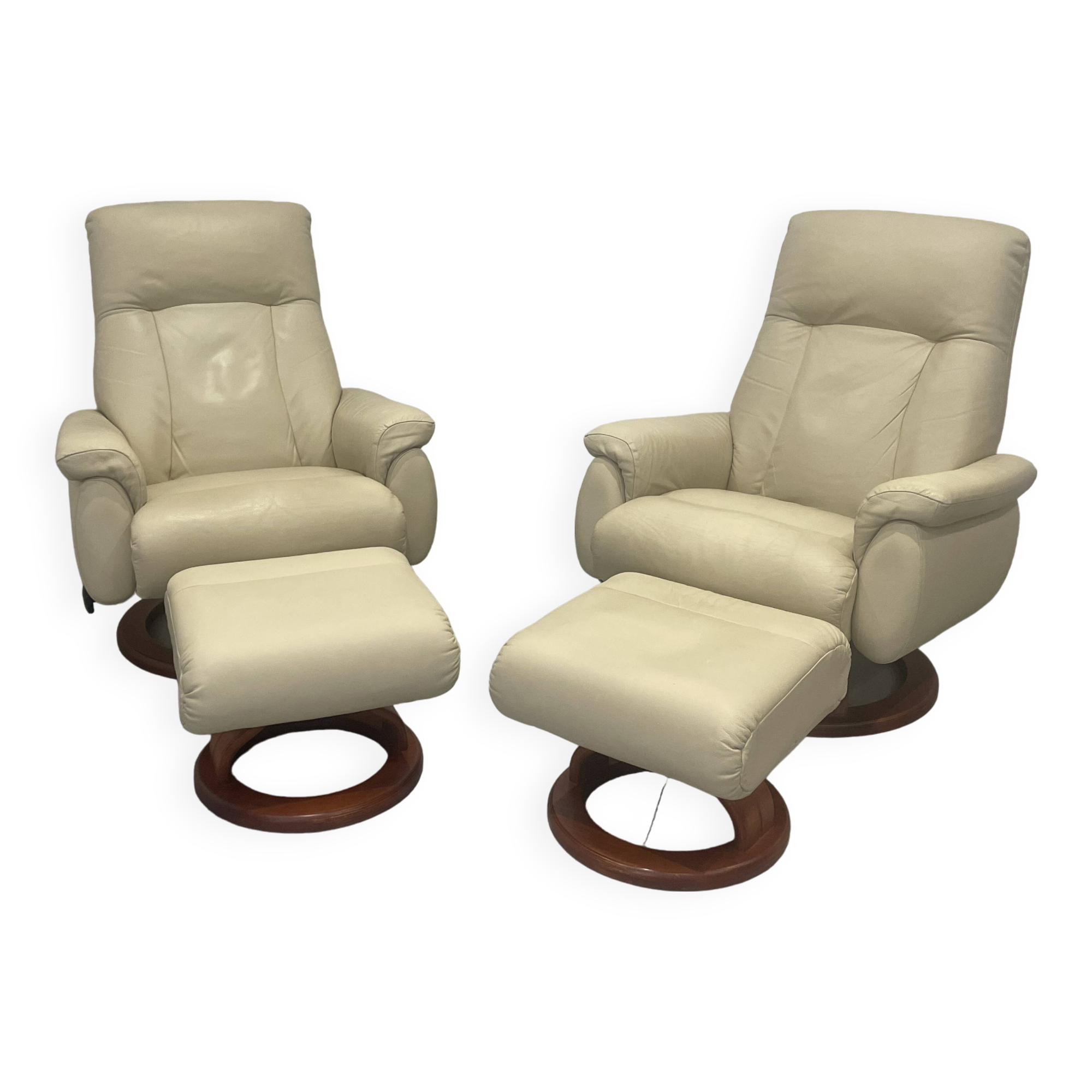 Pair of vintage leather armchairs with ottoman
