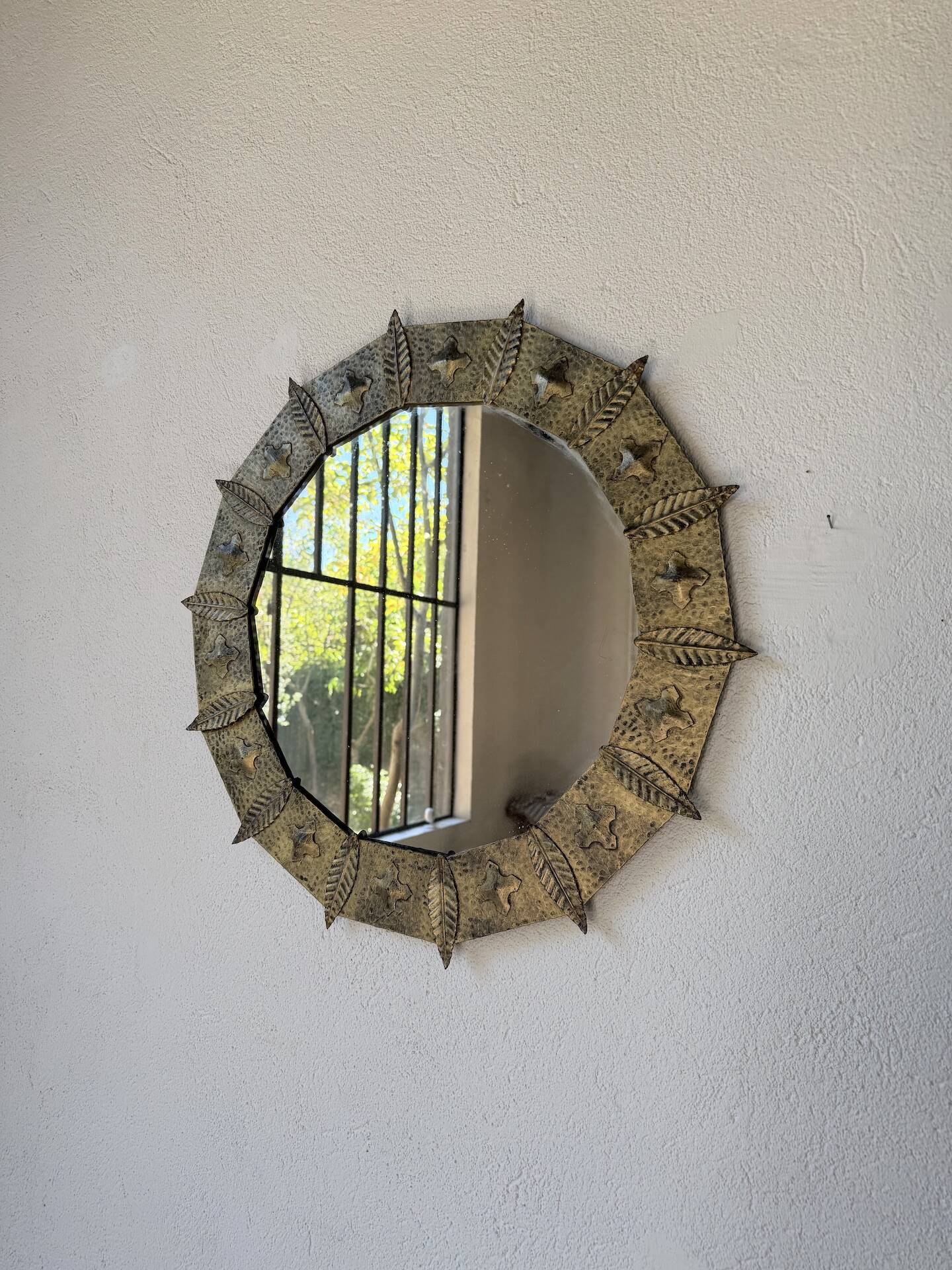Brutalist round hammered gold metal mirror