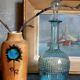 Blue glass carafe with vintage pegs