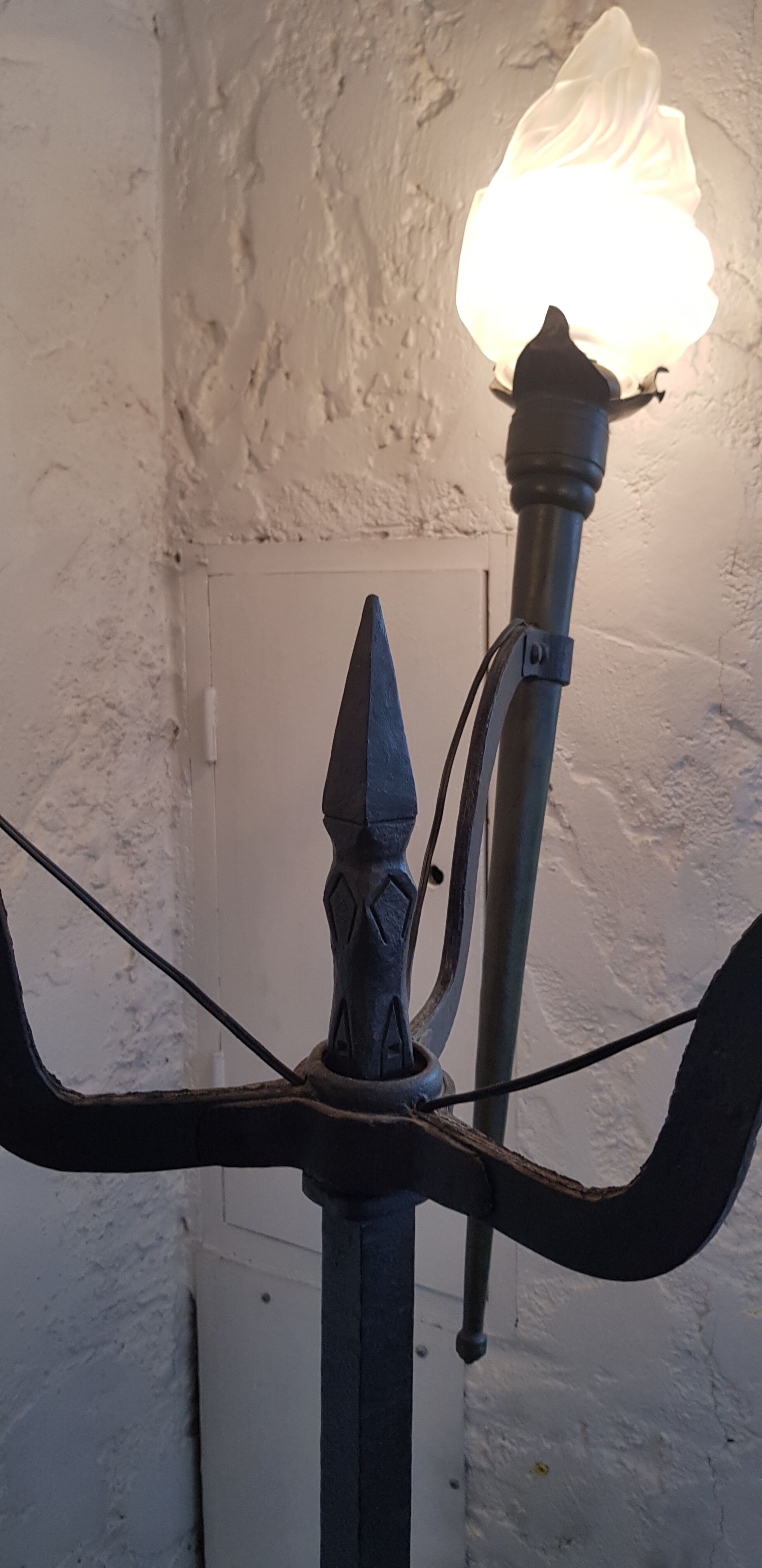 Old wrought iron tripod lamppost