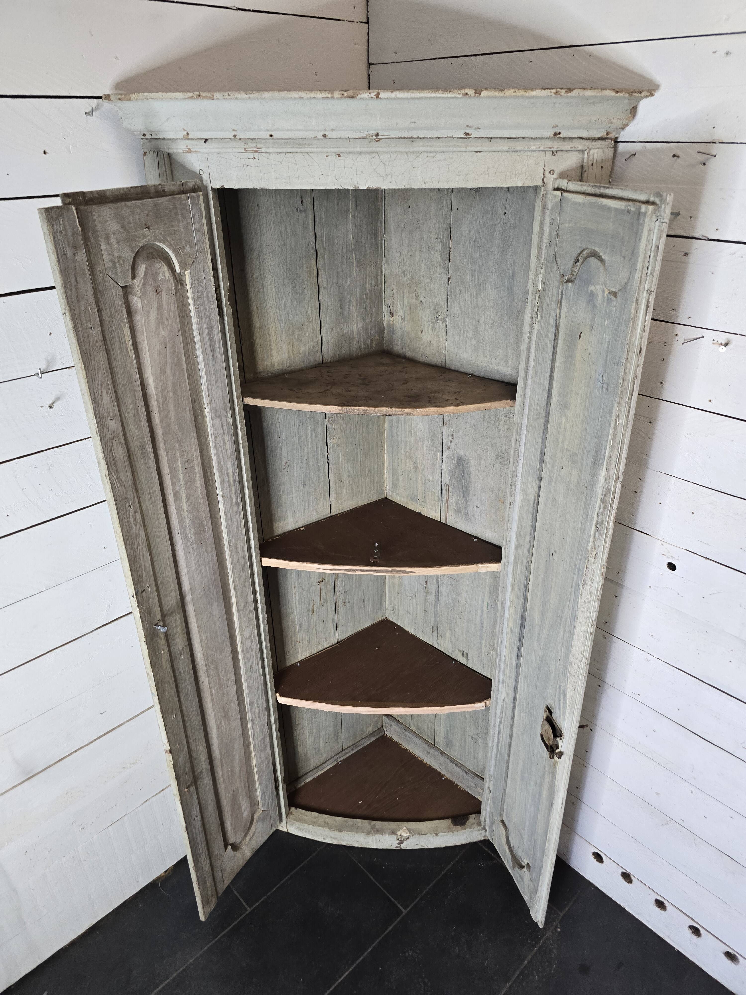 19th century curved corner cupboard in patinated oak