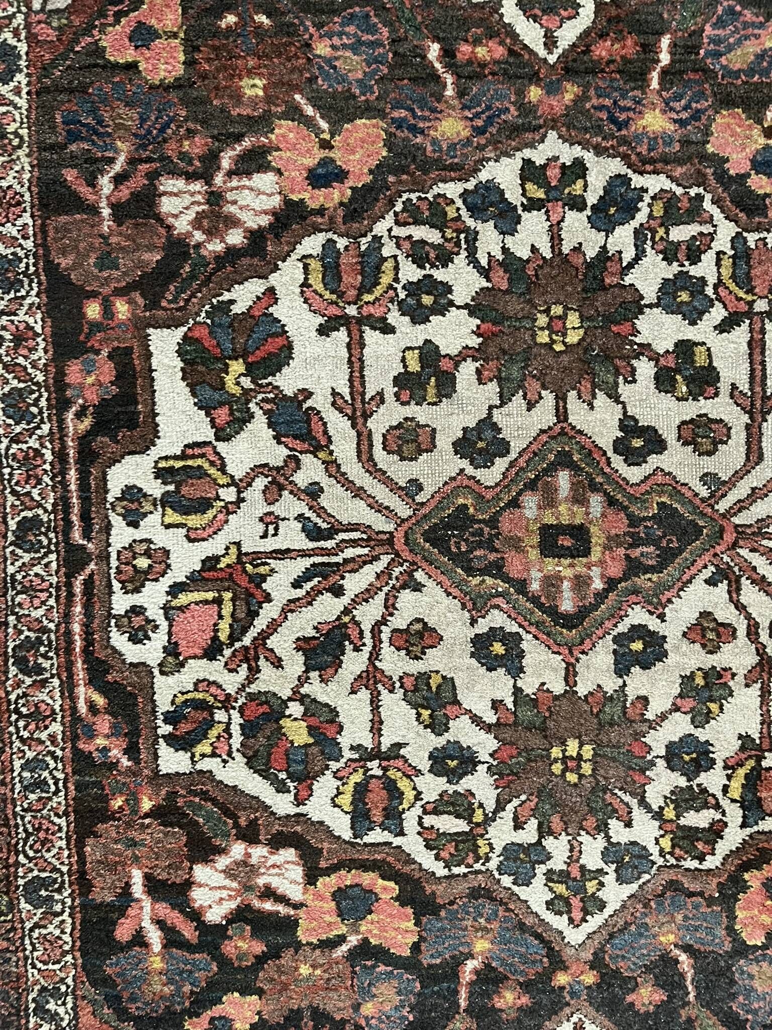 Antique handmade Hamadan Persian rug, ivory medallion on dark background 148x103.