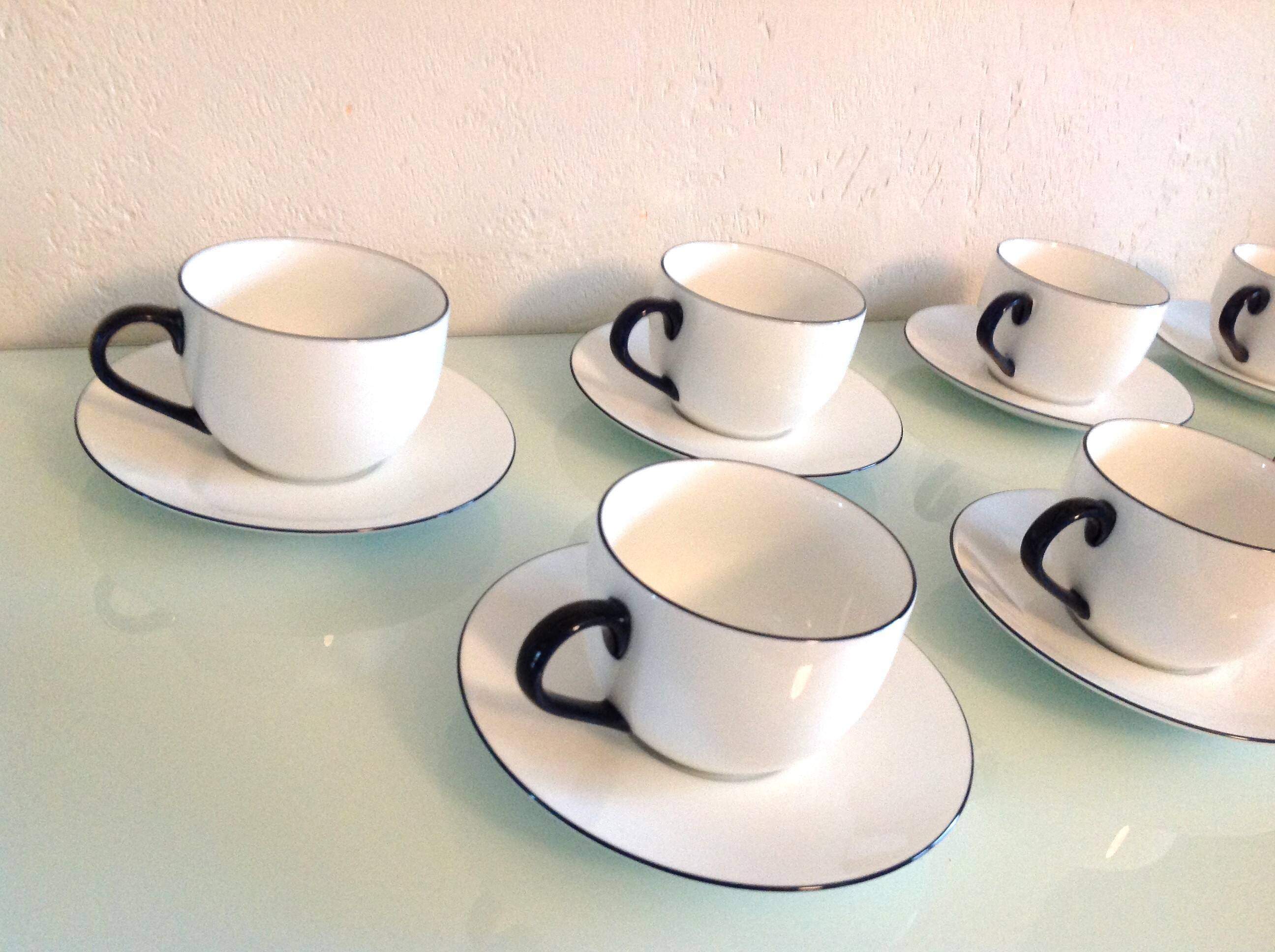 Set of eight white porcelain cups with blue edging / vintage 70s-80s