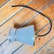 Small white and gold diabolo pendant.
