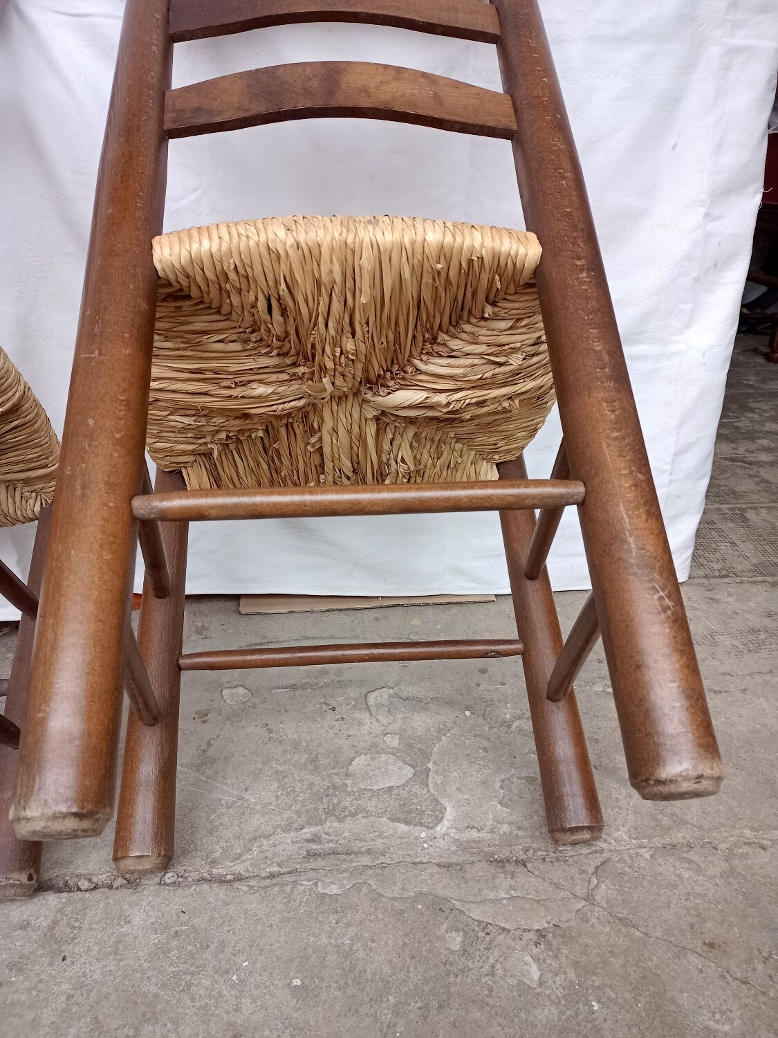 Brutalist chairs in walnut and straw