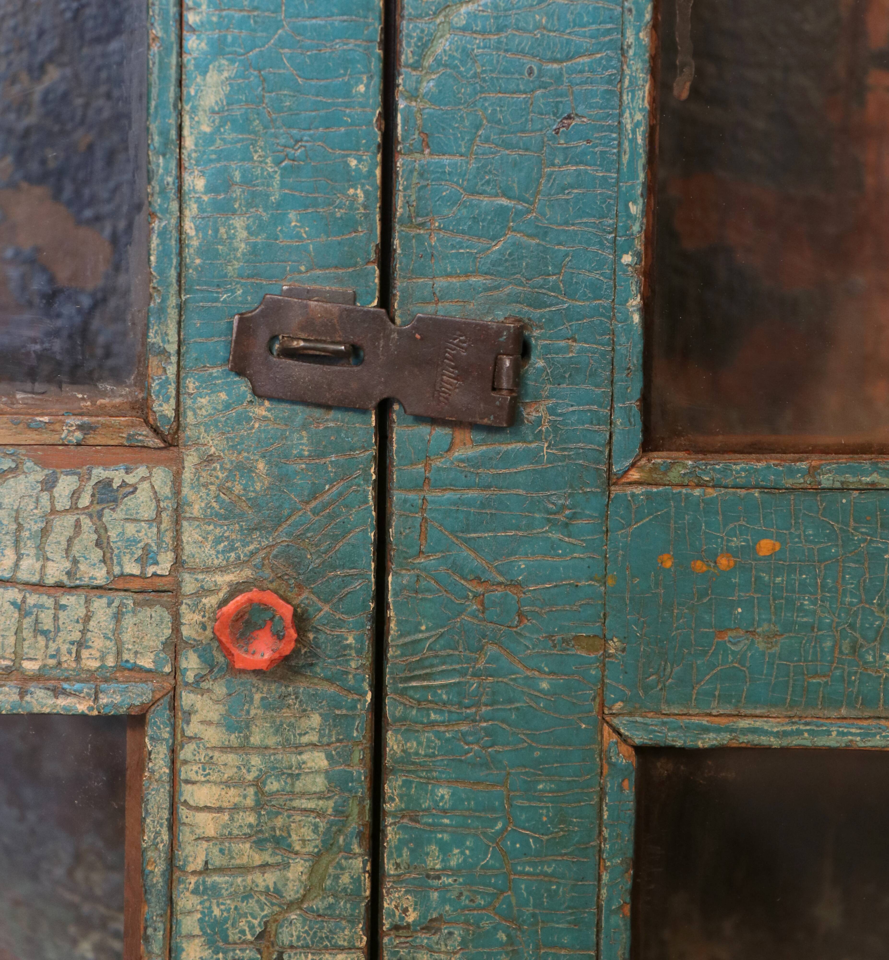 Old showcase in original blue patina Burmese teak