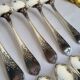 12 small silver-plated metal spoons by Guildart