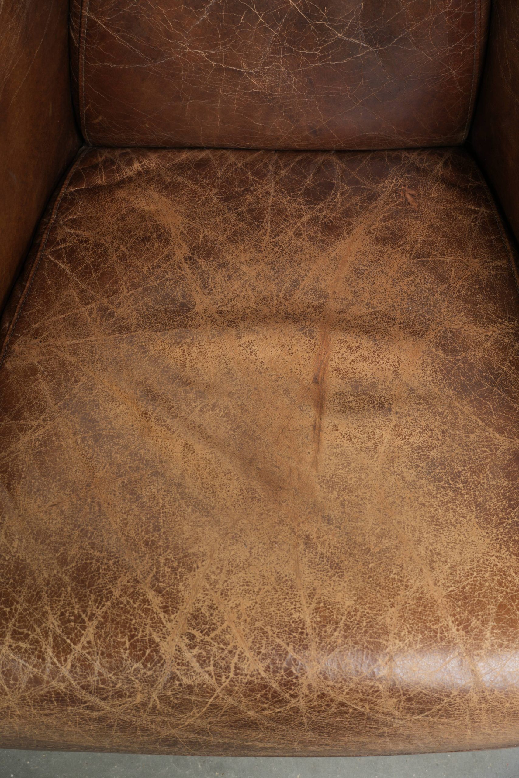 Fauteuil design aviateur en cuir de vache couleur cognac robuste
