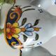 Antique egg holder by Jules Verlingue with polychrome floral decoration.