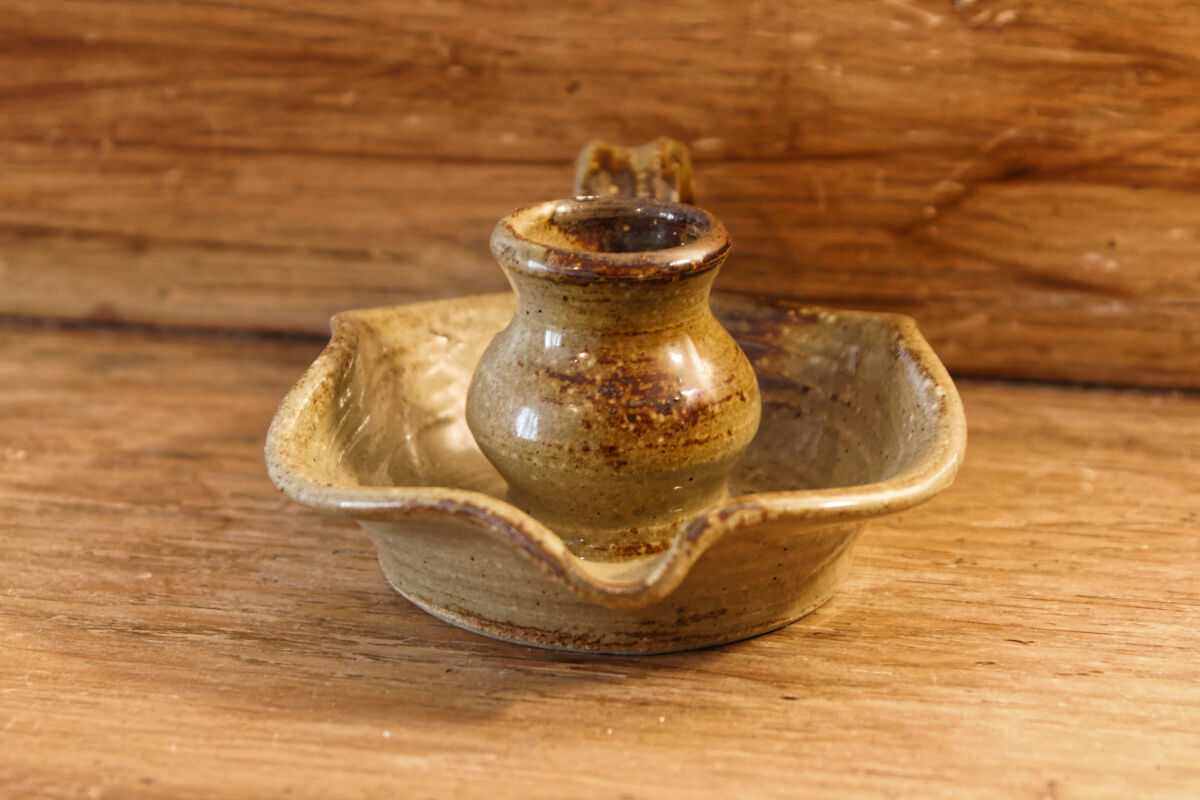 Signed sandstone candle holder