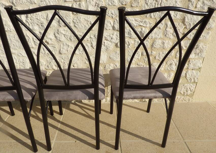 4 black metal chairs with high backs and gray suede tops
