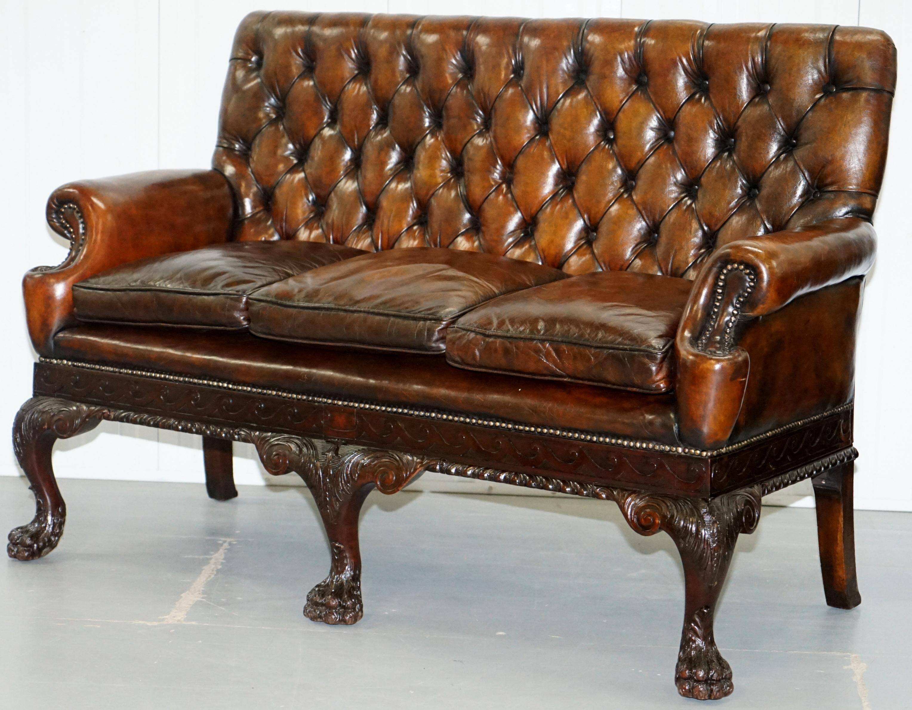 Chesterfield leather canapé in Georgian style with lion paw carved feet.