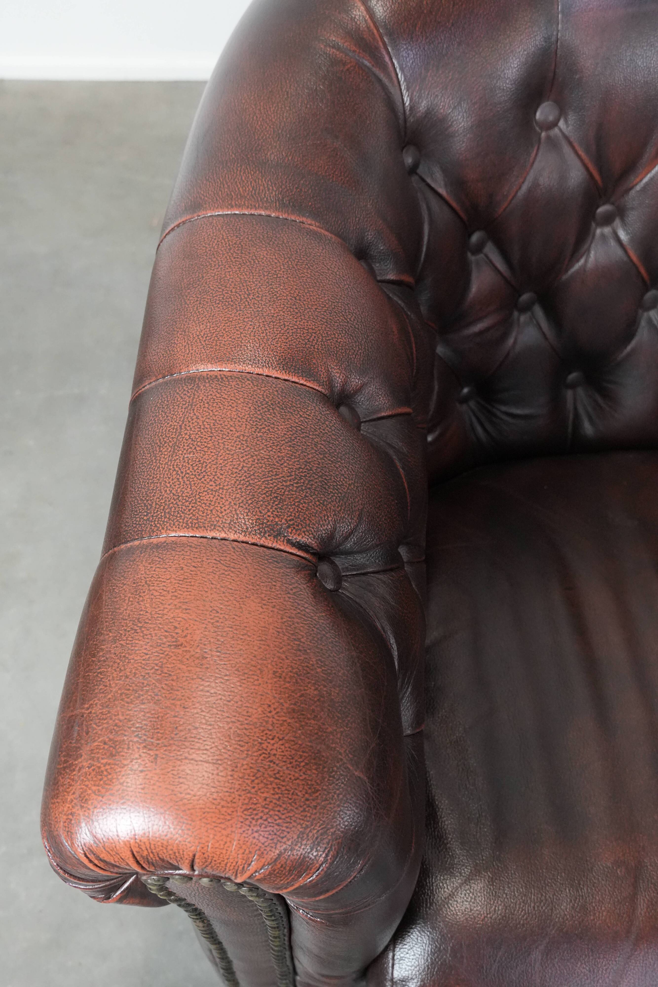 Set of three classic English-style Chesterfield cowhide  club armchairs