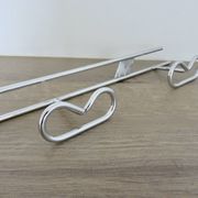 Large vintage wall-mounted coat rack in chrome metal