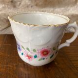 Porcelain cup with chiseled and gilded rim