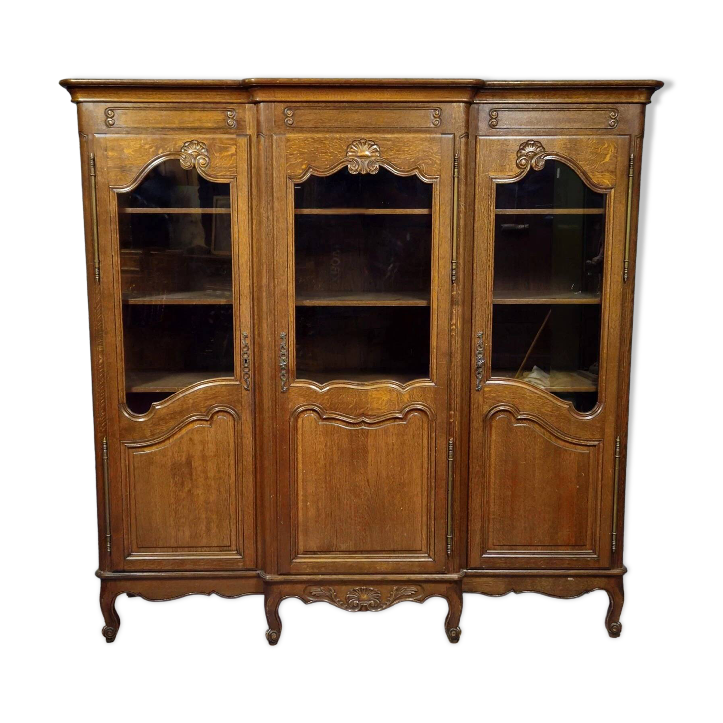 Large Provençal library in Louis XV style made of oak from the 20th century.
