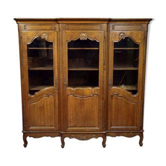 Large Provençal library in Louis XV style made of oak from the 20th century.