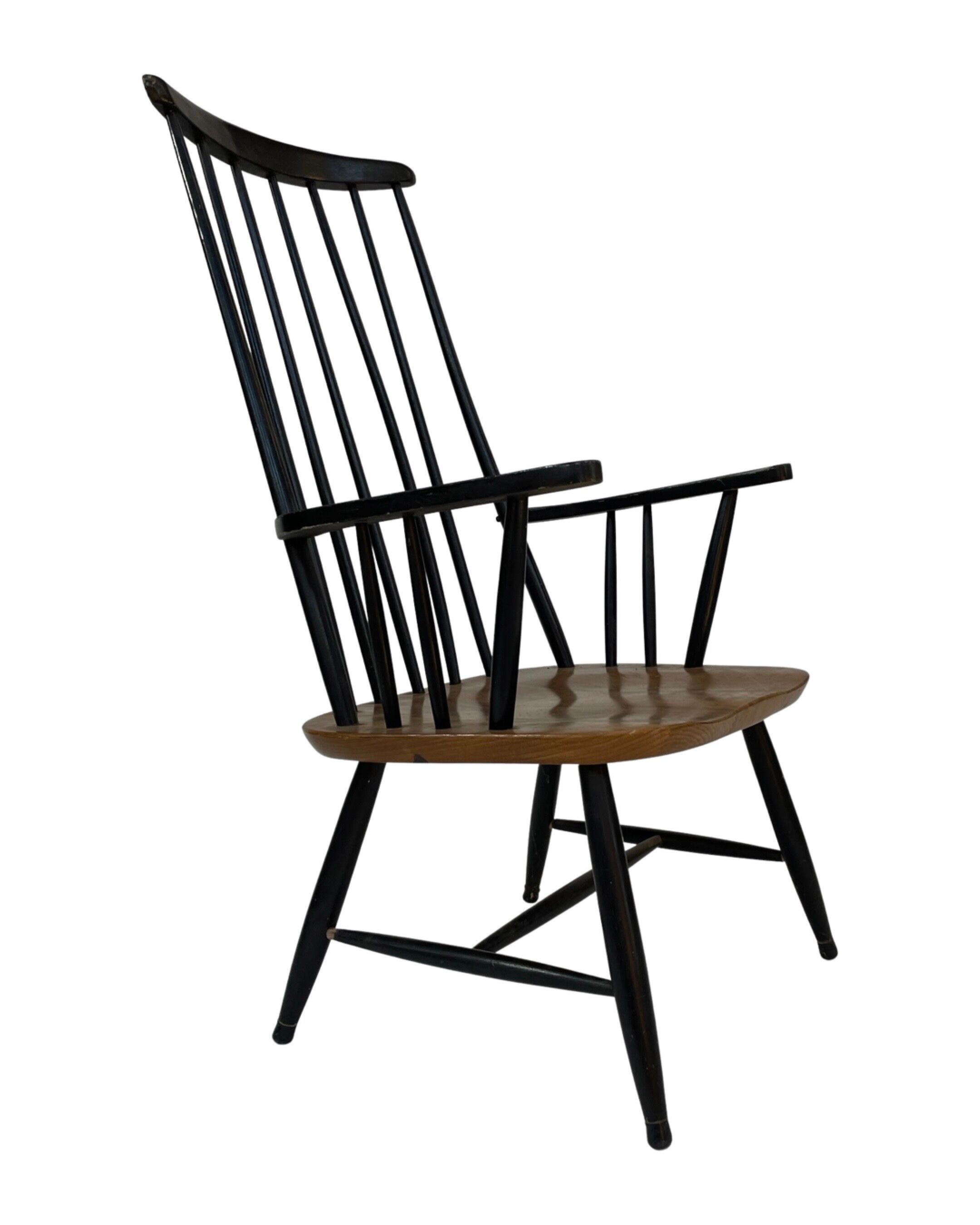 Vintage easy chair with high back and armrest from the 60s