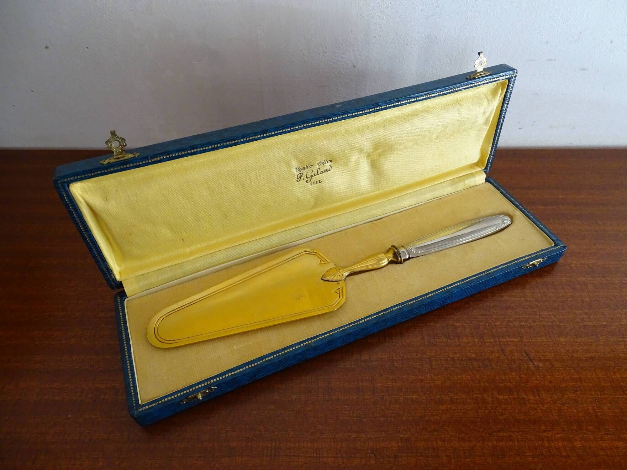 Antique silver and gilded metal pie shovel in case