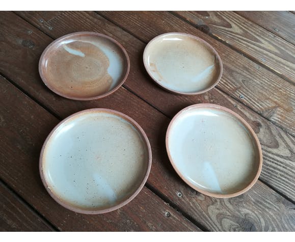 Lot of 4 deep plates made of vintage sandstone