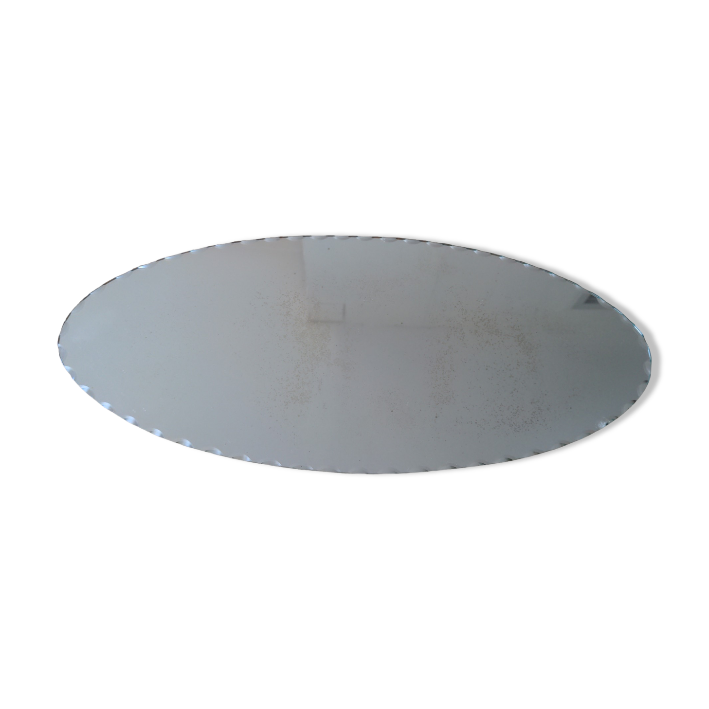 Vintage chiseled bevelled mirror under oval velvet