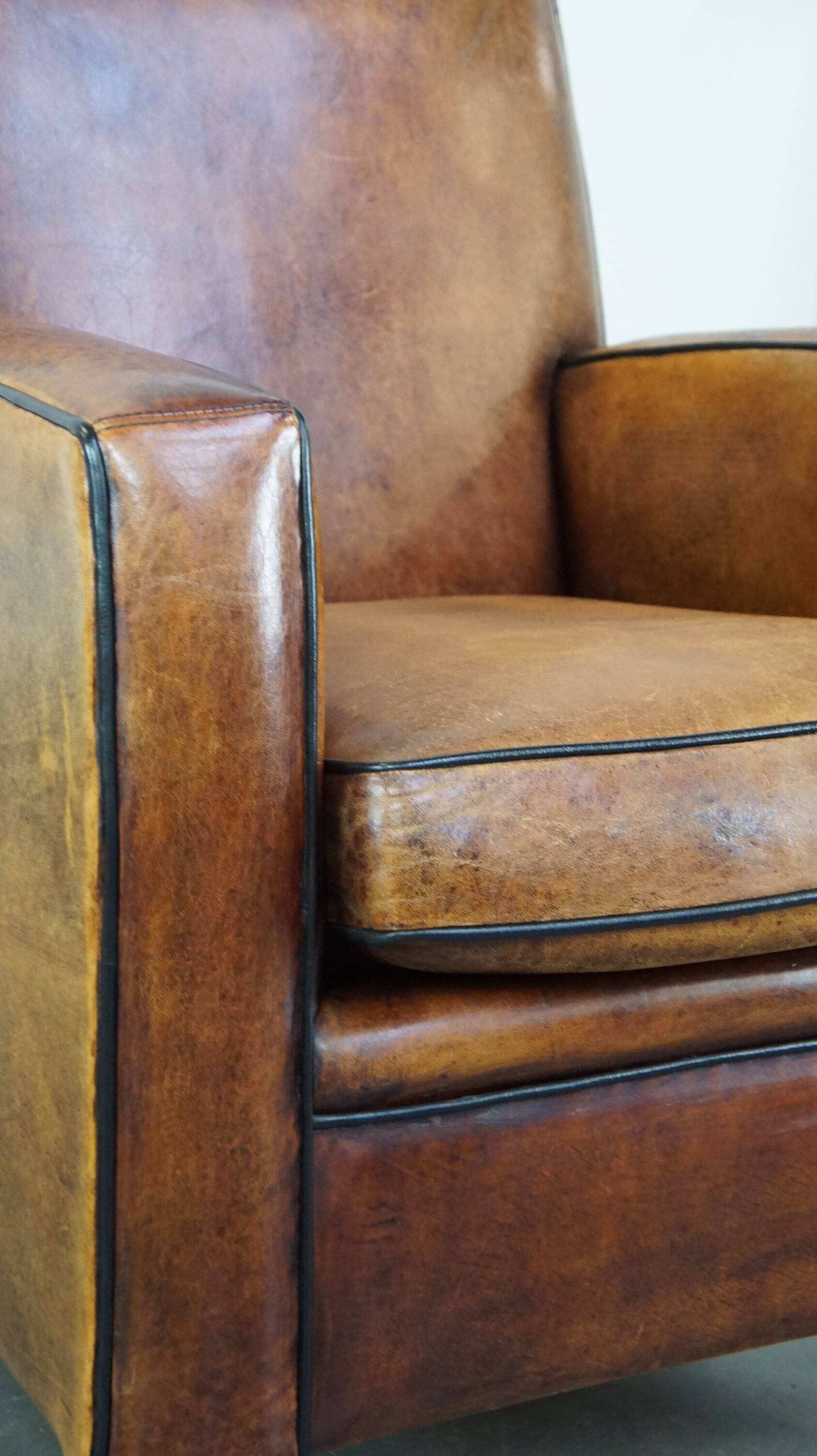 Art Deco sheep leather armchair with a lot of character