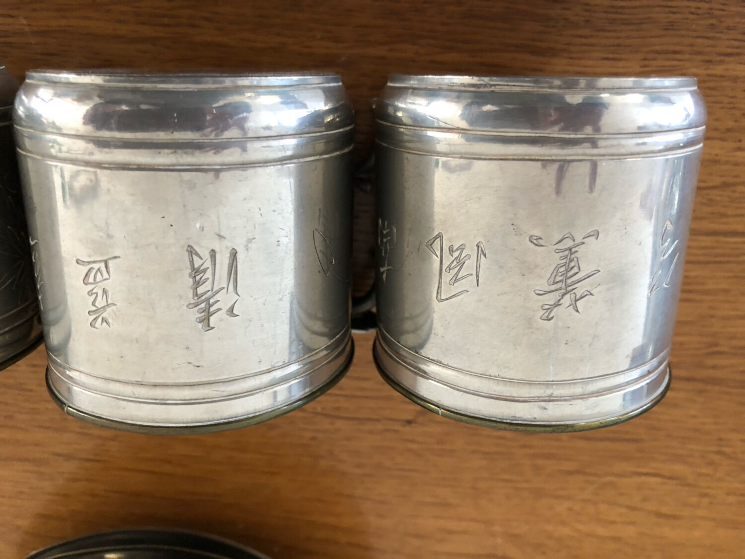 6 cups and sub-cups in pewter motifs birds and flowers and Chinese inscription