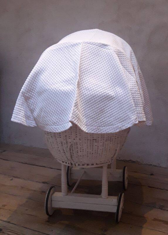 Wicker and painted wood baby cradle