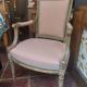 Patinated Louis XVI style armchair