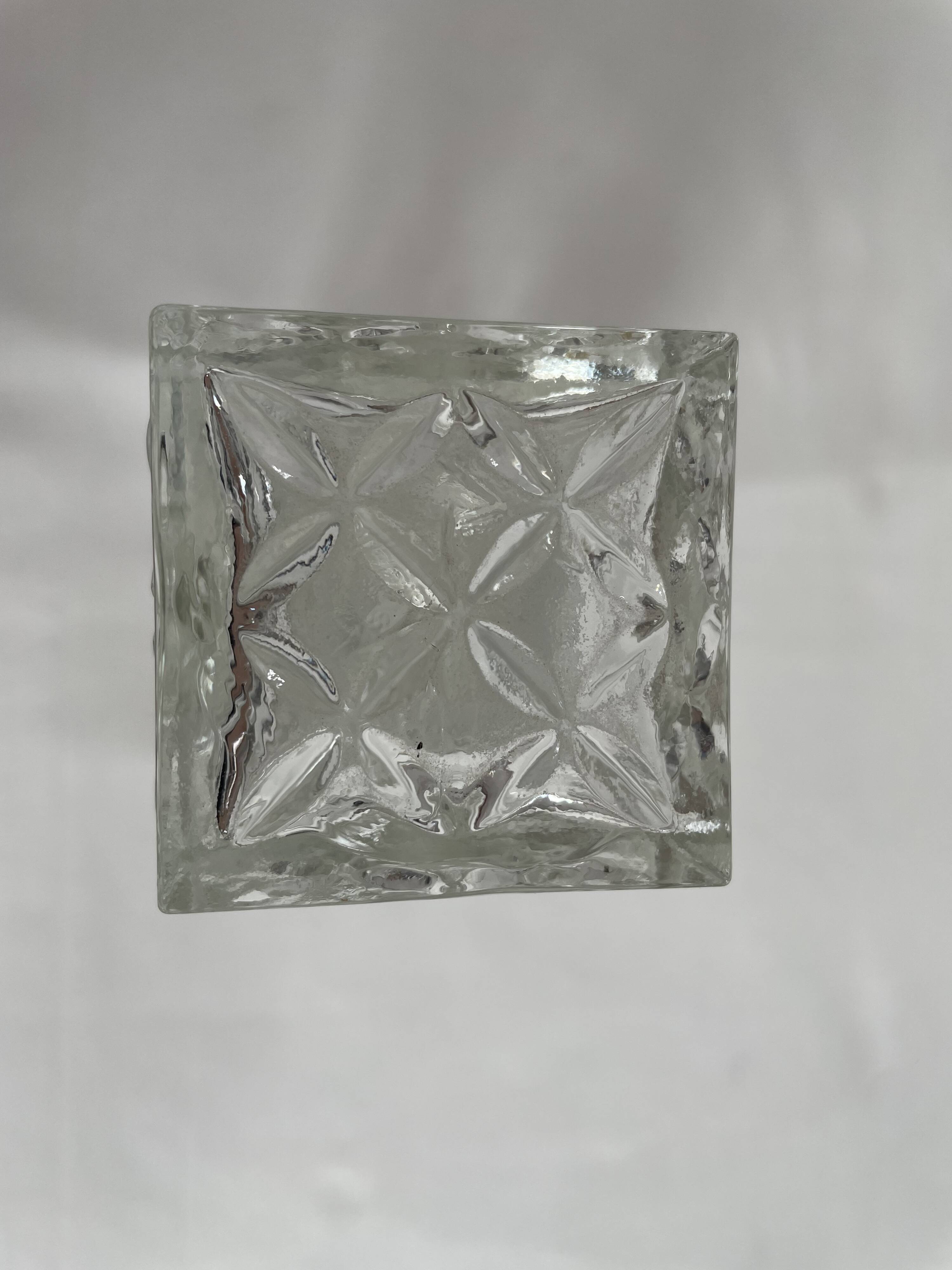 Molded glass carafe, 1960s-1970s, stylized flower decoration, oval, square base, stopper, rosette