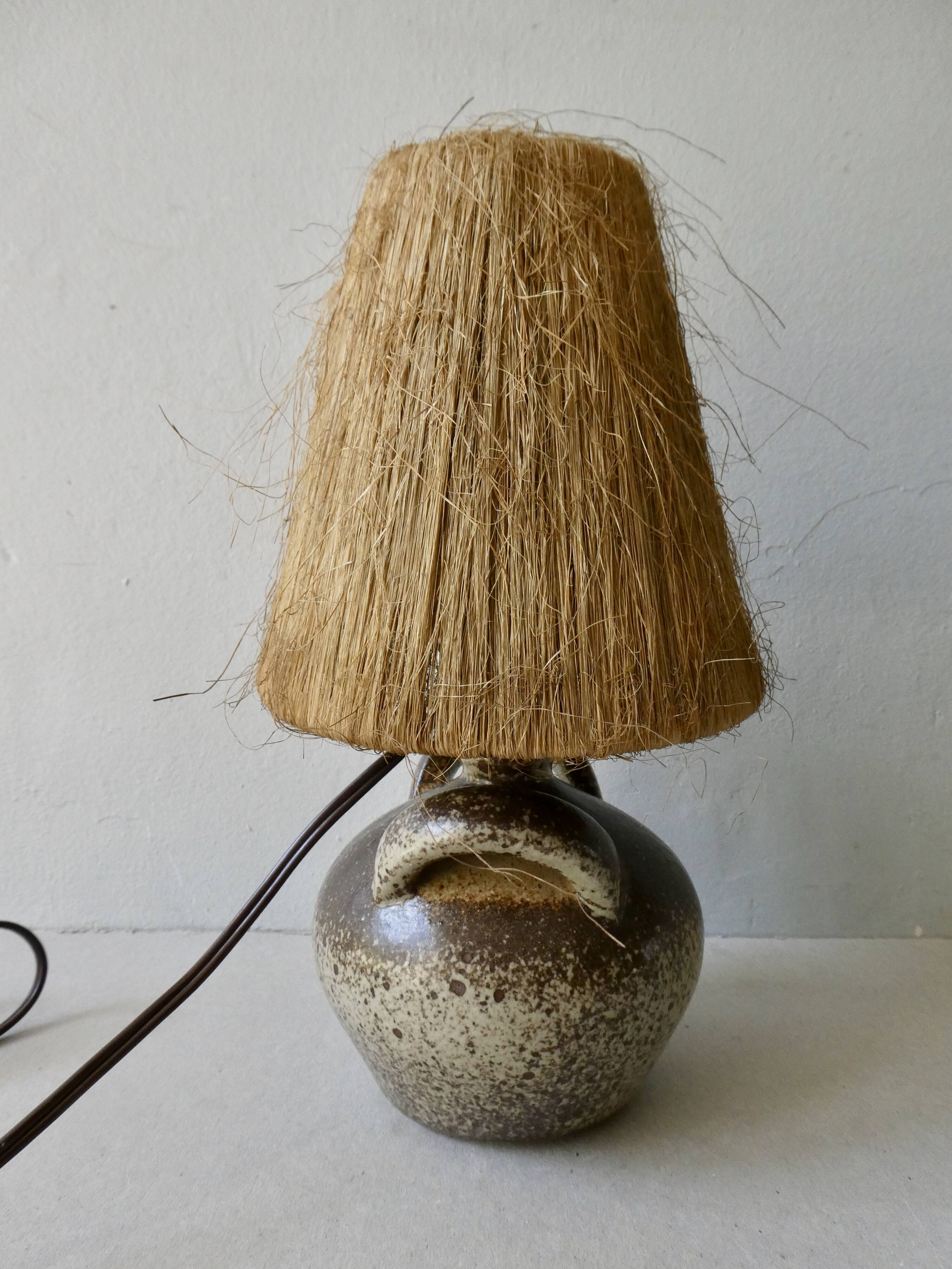 Sandstone lamp with natural fiber lampshade