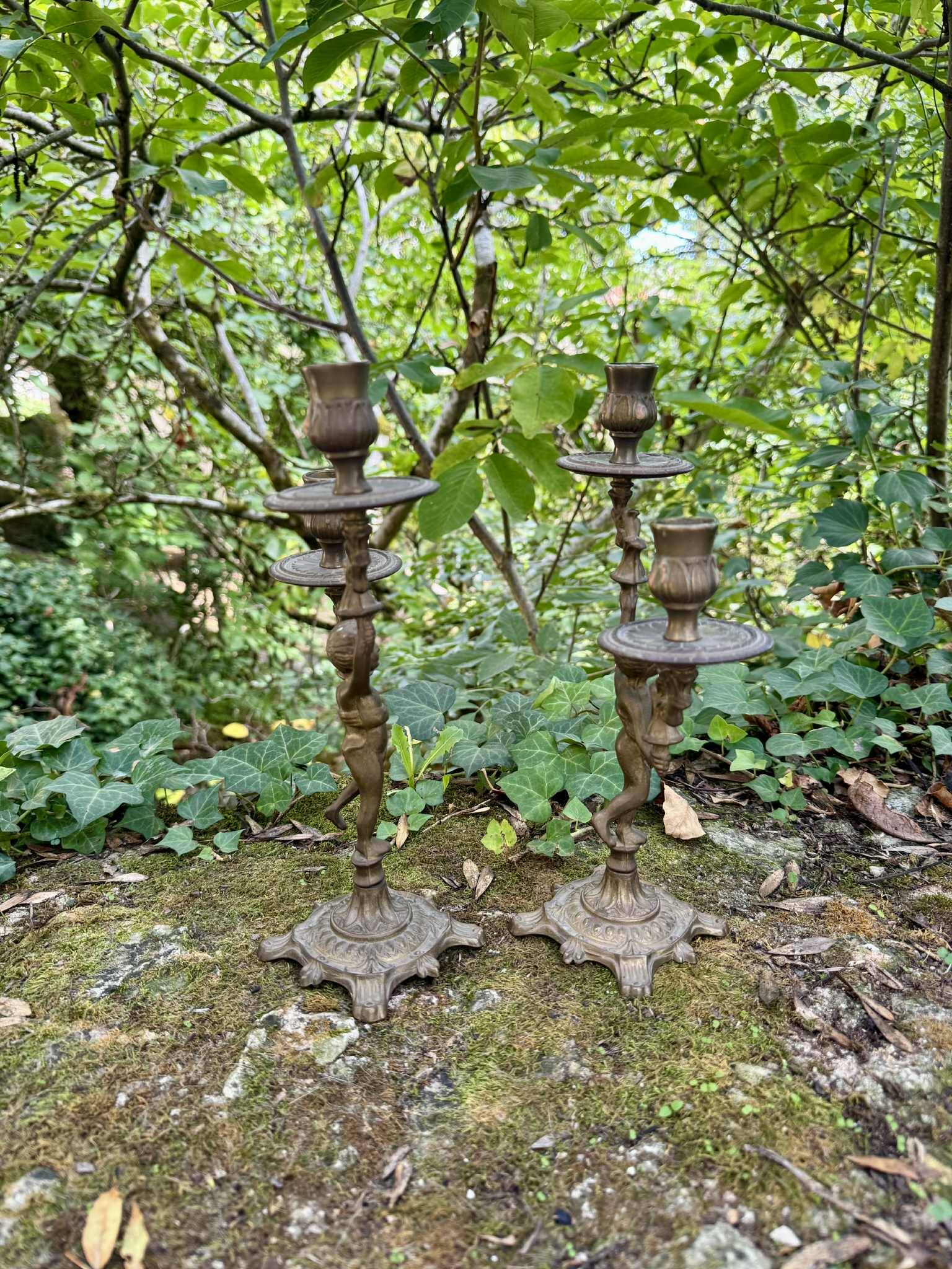 Pair of brass cherub candlesticks