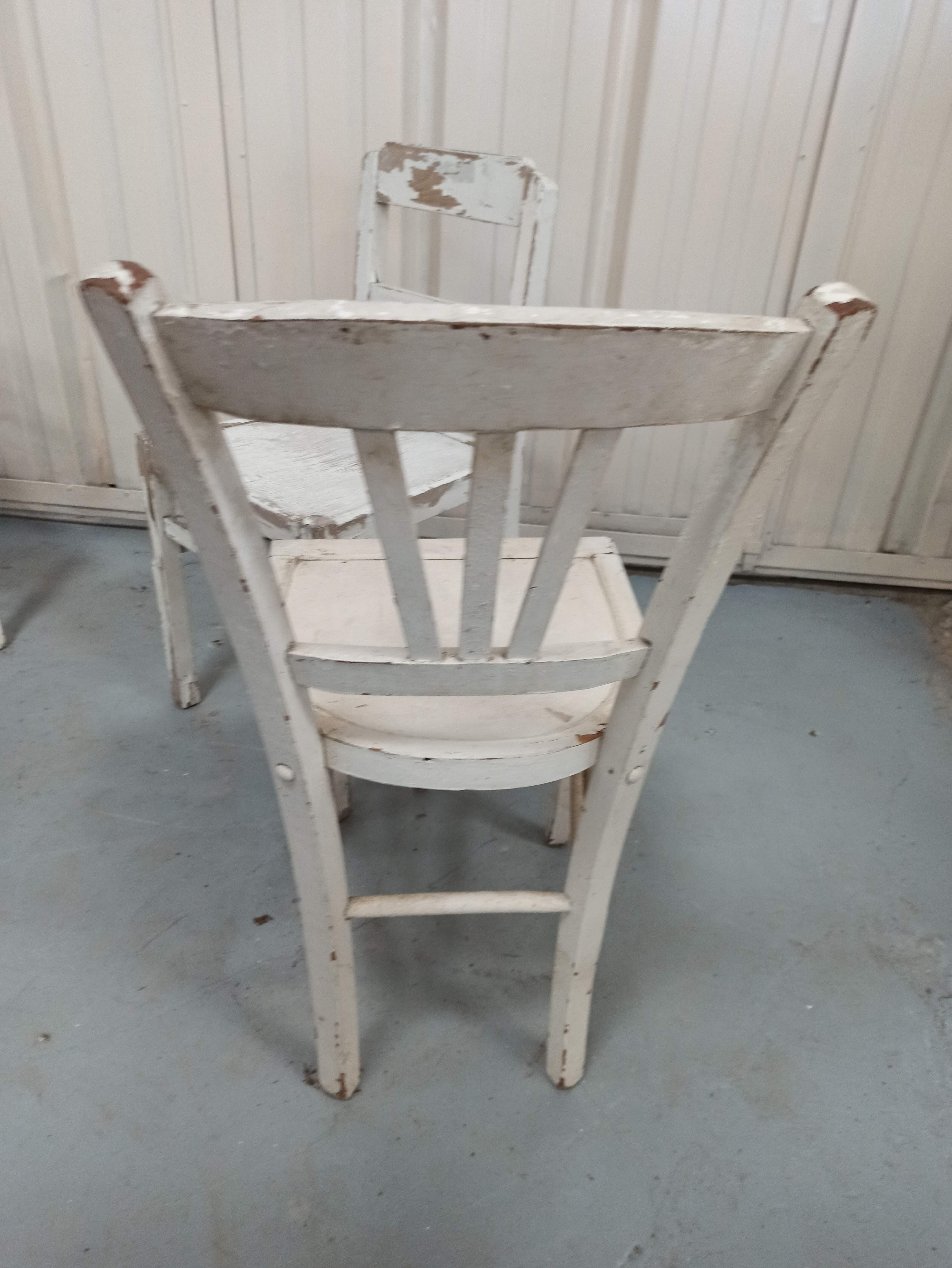 4 patinated white bistro chairs